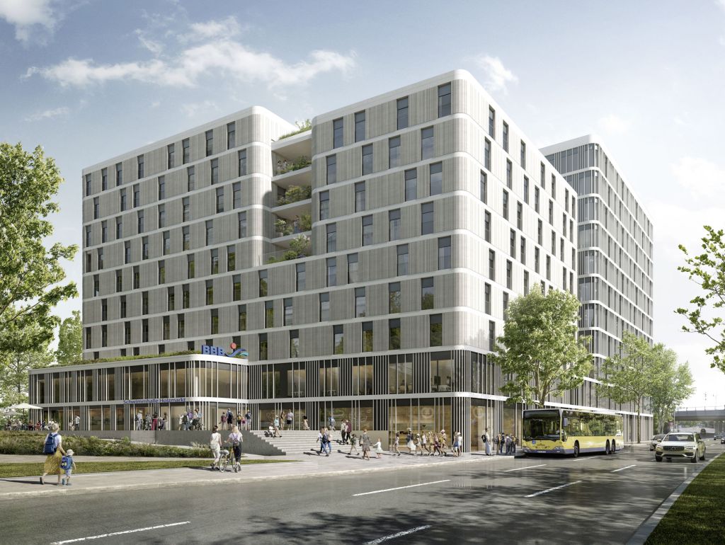 Modernes, mehrstöckiges Gebäude am Holzmarkt mit großer Glasfront im Erdgeschoss und begrünten Terrassen. Vor dem Gebäude befinden sich Fußgänger, Bäume und ein Bus. Die moderne Architektur verbindet Gewerbe, öffentliche Einrichtungen und urbanes Leben.